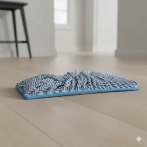 An isolated close-up of a reusable, machine-washable microfiber cleaning pad, highlighting a key feature of the best mops for LVP floors.