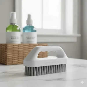 Ergonomic scrub brush, designed for deep cleaning, shown as a key tool in the bathroom cleaner kit.