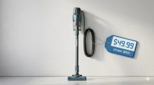 A compact corded stick vacuum under $50 standing upright in a modern apartment closet space.