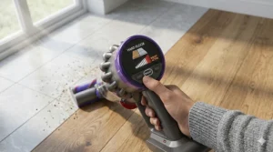 User adjusting the suction control settings on a multi-surface vacuum cleaner.