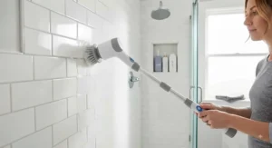 Extendable electric bathroom scrubber for tile and grout reaching high shower corners