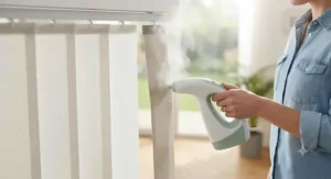 A lightweight handheld steamer removing dust and grime from vertical window blinds efficiently.