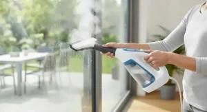 A versatile multi-surface handheld steam cleaner cleaning glass sliding doors and windows.