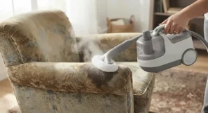 A steam cleaner with attachments for upholstery effectively refreshing an old armchair.