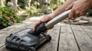 Attaching the spray wand to a surface cleaner attachment for driveway pressure washing on a sunny afternoon.